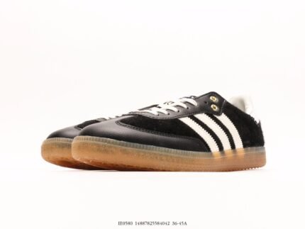 Black sneakers with white stripes and brown soles