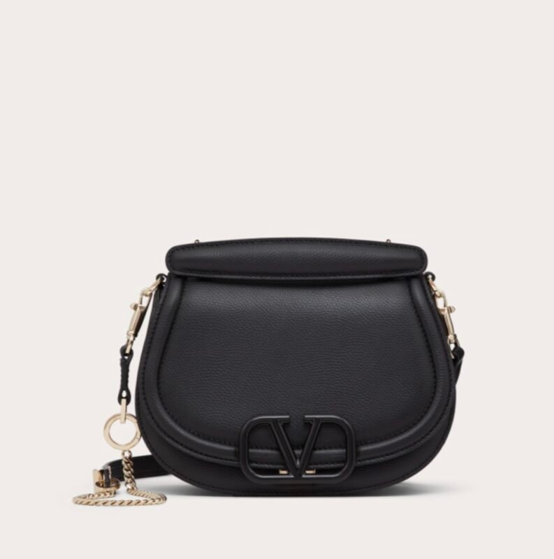 Dark blue crossbody bag with a metal chain strap and metal buckle