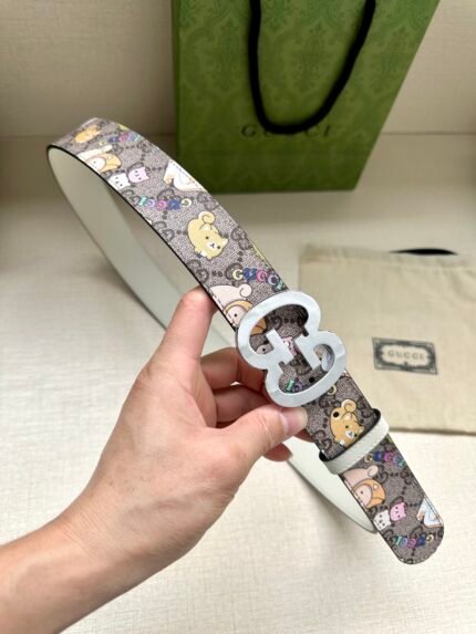 Hand holding a belt with cartoon characters