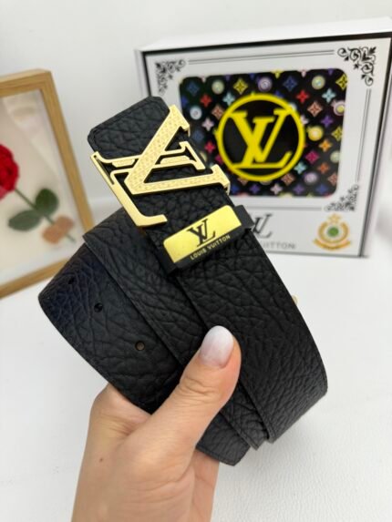 Black Louis Vuitton belt with gold buckle, LV logo