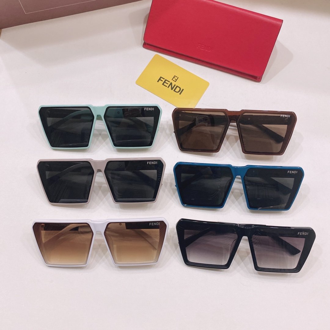 Fendi Sunglasses Collection The image displays a collection of Fendi sunglasses in various colors, including light blue, brown, white, blue, and black. The sunglasses are neatly arranged on a white surface, with a Fendi branded card and wallet placed in the background.