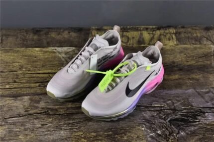 A pair of gray sports shoes with la neonces, placed on a wooden surface