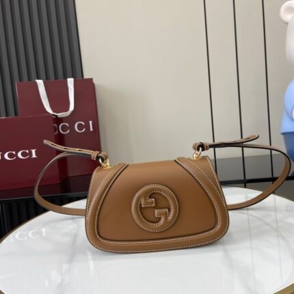 Brown leather handbag with brown double G logo