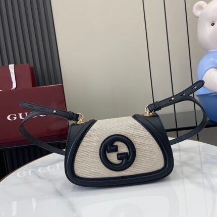 Beige canvas and black leather handbag with black double G logo