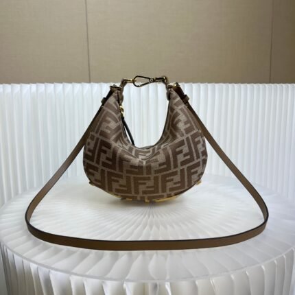 Brown patterned shoulder bag with gold metal hardware, on a white background