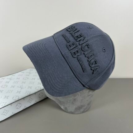 Dark gray baseball cap with text and pattern design.