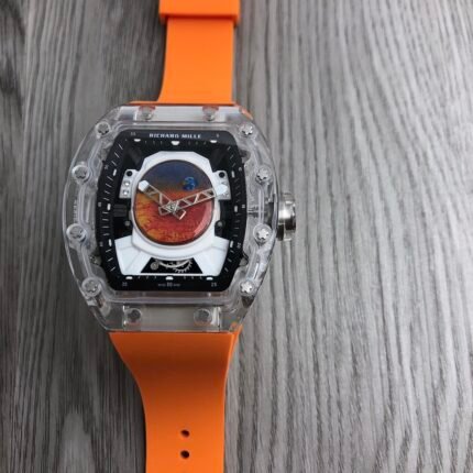 An orange wristwatch with a red and black dial on an orange strap.